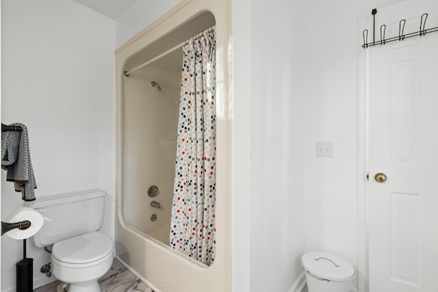 bathroom featuring shower / bath combo and toilet