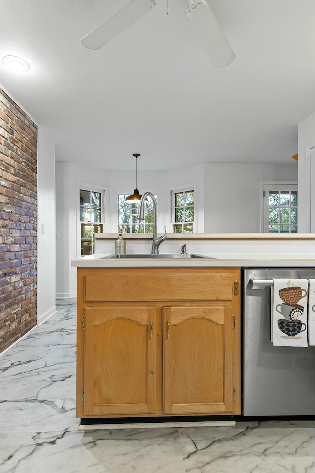 kitchen with dishwasher, brick wall, decorative light fixtures, and a wealth of natural light