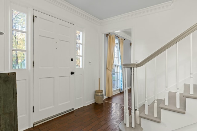 entryway with a wealth of natural light and ornamental molding