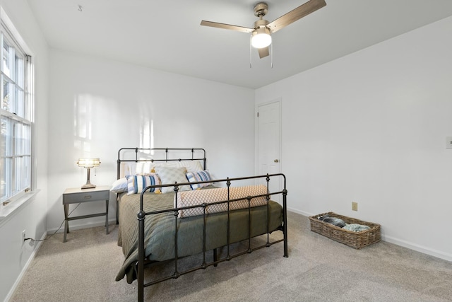 bedroom featuring ceiling fan and light colored carpet