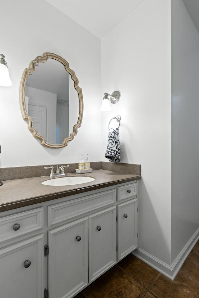 bathroom with tile patterned floors and vanity