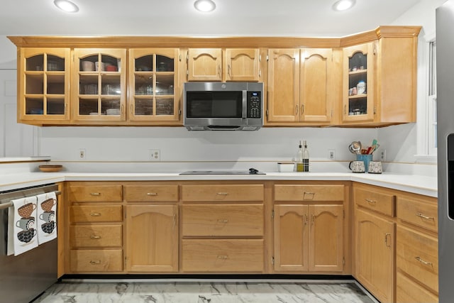 kitchen featuring appliances with stainless steel finishes and light brown cabinetry