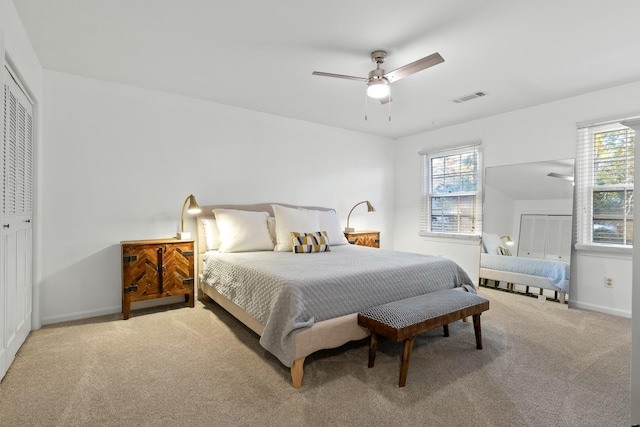 bedroom with carpet flooring, ceiling fan, and a closet