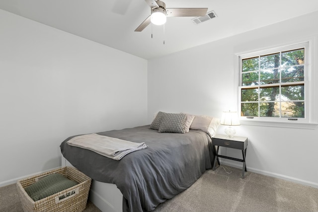 bedroom with ceiling fan and carpet floors