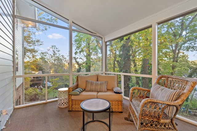 sunroom / solarium with a wealth of natural light and lofted ceiling