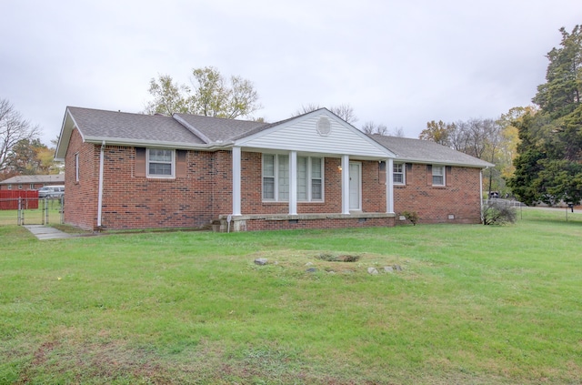 single story home featuring a front yard