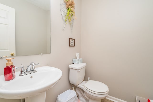 bathroom with sink and toilet