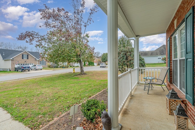 view of yard with covered porch