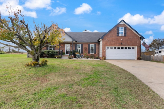 view of front of home with a front yard and a garage