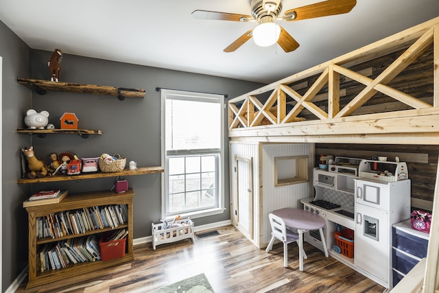 bedroom featuring wood-type flooring and ceiling fan