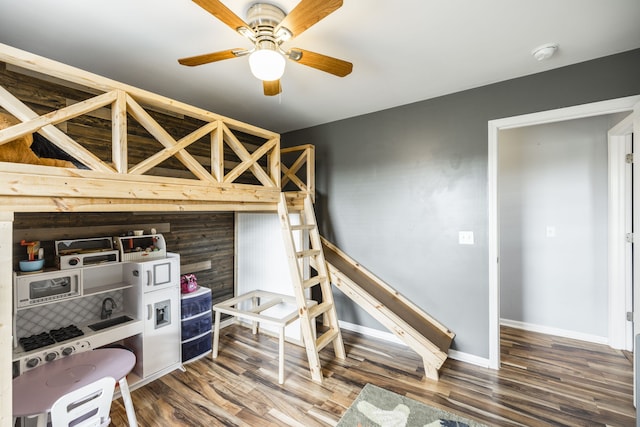 bedroom featuring hardwood / wood-style floors and ceiling fan