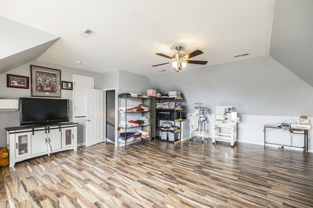 miscellaneous room with hardwood / wood-style flooring, ceiling fan, and vaulted ceiling