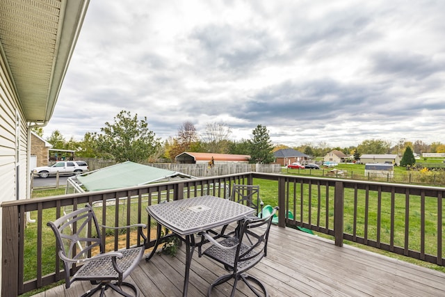 wooden deck with a yard