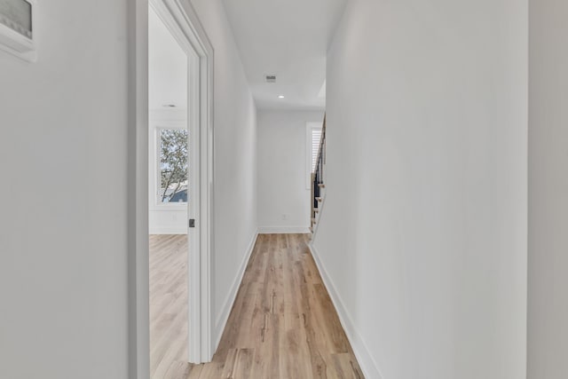 hall with light wood-type flooring