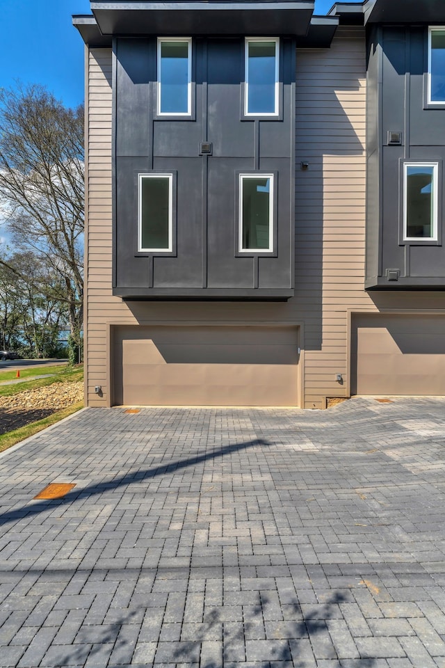 view of property exterior featuring a garage