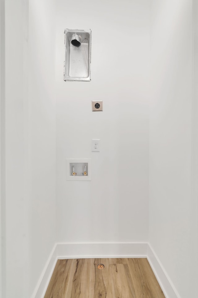 laundry room featuring hookup for an electric dryer, washer hookup, and hardwood / wood-style flooring