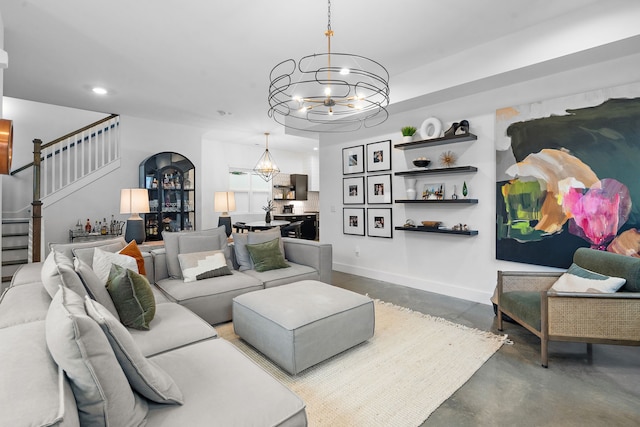 living room with a notable chandelier