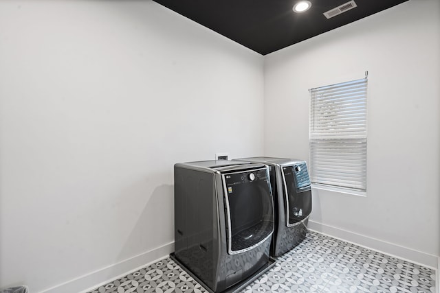 laundry area with independent washer and dryer