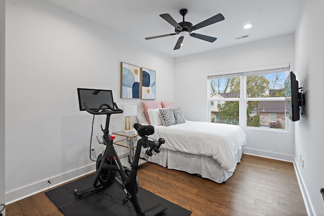 bedroom featuring ceiling fan and dark hardwood / wood-style floors