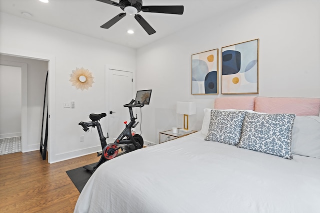 bedroom featuring dark hardwood / wood-style flooring and ceiling fan