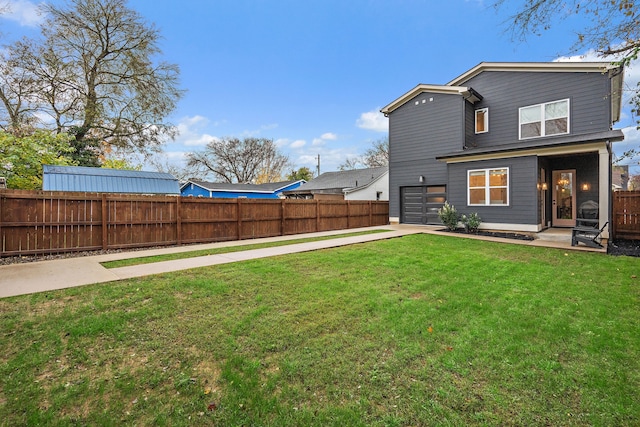 exterior space featuring a yard and a garage