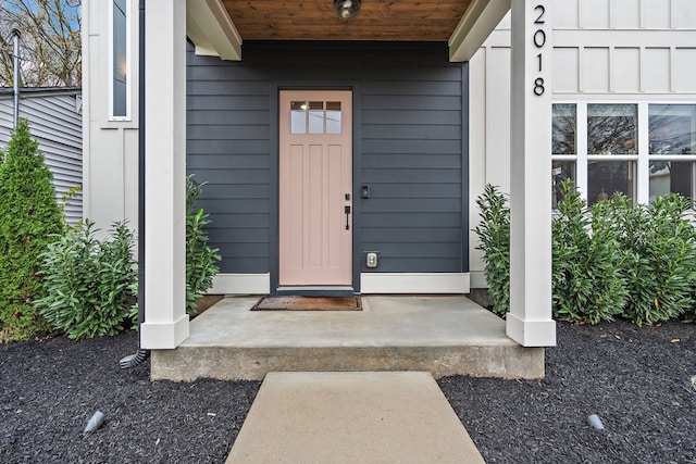 doorway to property featuring a porch