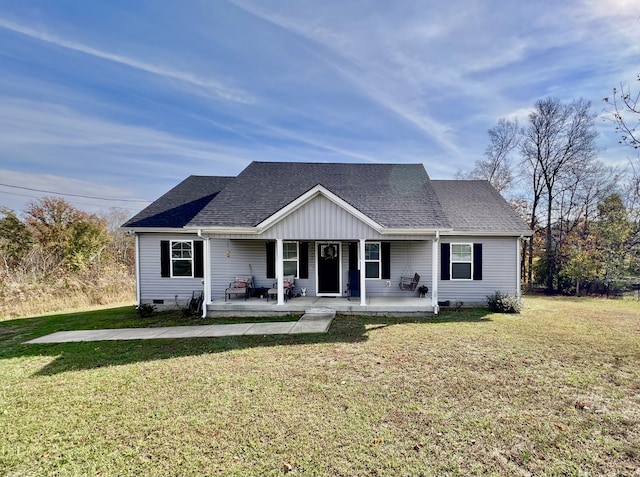 view of front facade with covered porch and a front yard