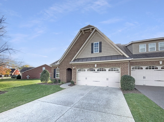 view of front of home with a garage and a front lawn