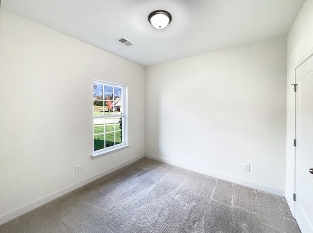 spare room featuring carpet