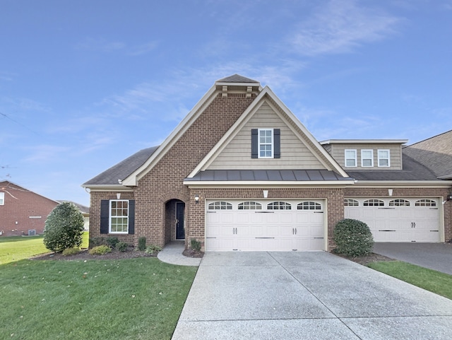 view of front of property featuring a front yard and a garage