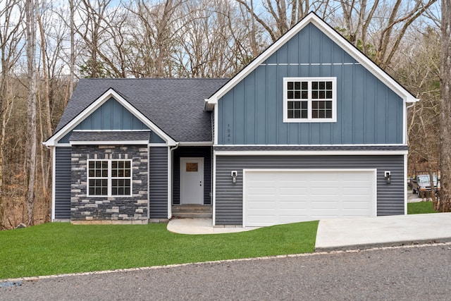 view of front of property featuring a garage and a front yard