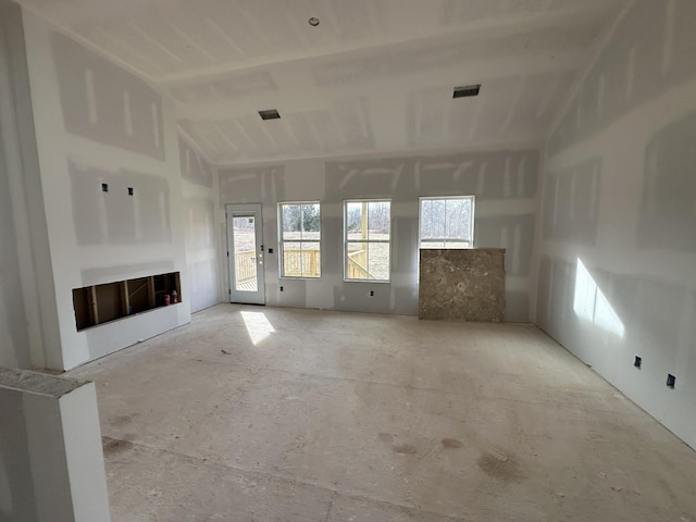 unfurnished living room with visible vents and a fireplace