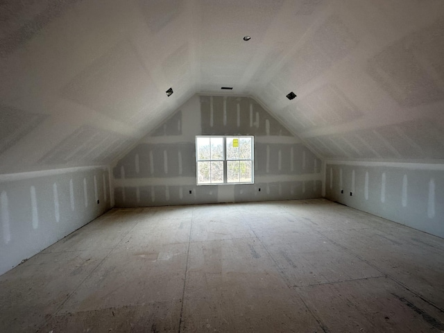 bonus room featuring lofted ceiling