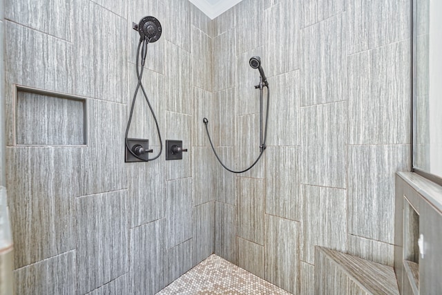 bathroom with tiled shower