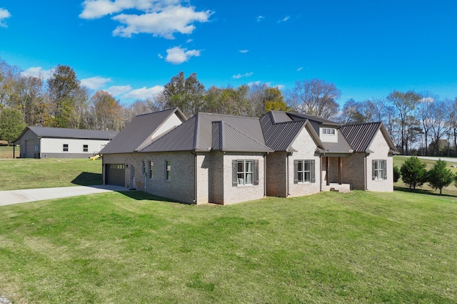 view of front of home with a front yard and a garage