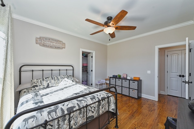 bedroom featuring dark hardwood / wood-style floors, ceiling fan, and ornamental molding