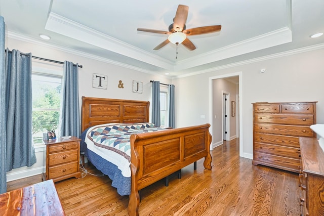 2189 Double Branch Rd, Columbia, TN 38401 - bedroom featuring a tray ceiling, light wood-style flooring, ornamental molding, a ceiling fan, and recessed lighting
