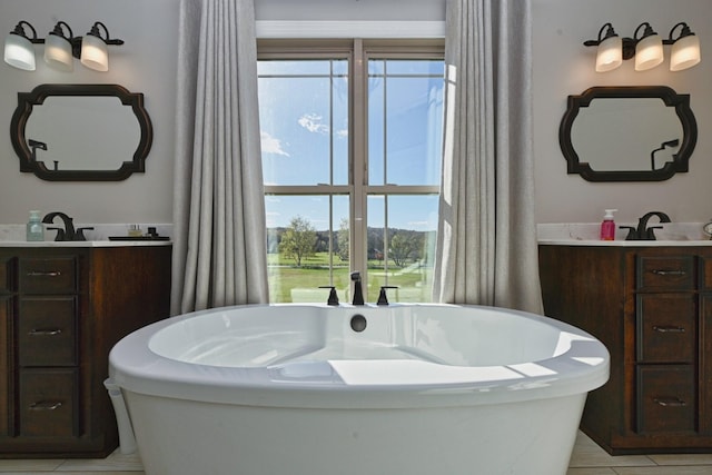 2189 Double Branch Rd, Columbia, TN 38401 - full bathroom featuring a soaking tub, plenty of natural light, and vanity