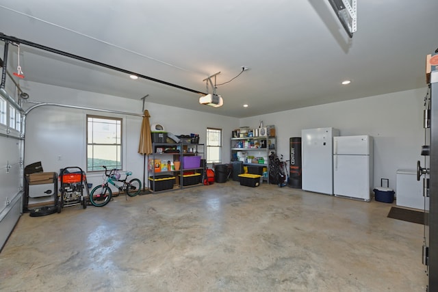 garage with white fridge and a garage door opener