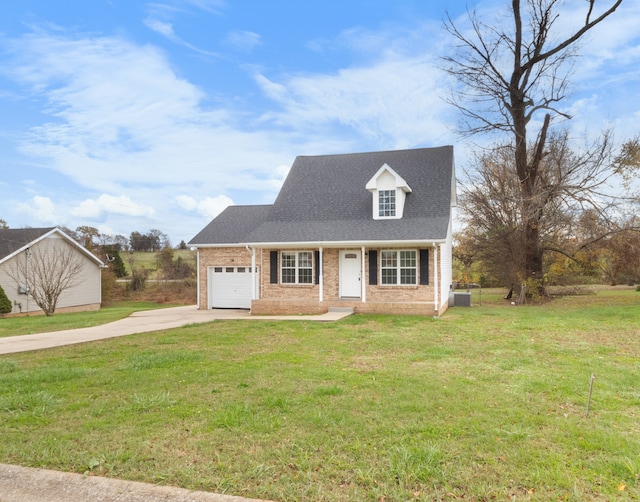 cape cod home featuring central air condition unit, a front yard, and a garage