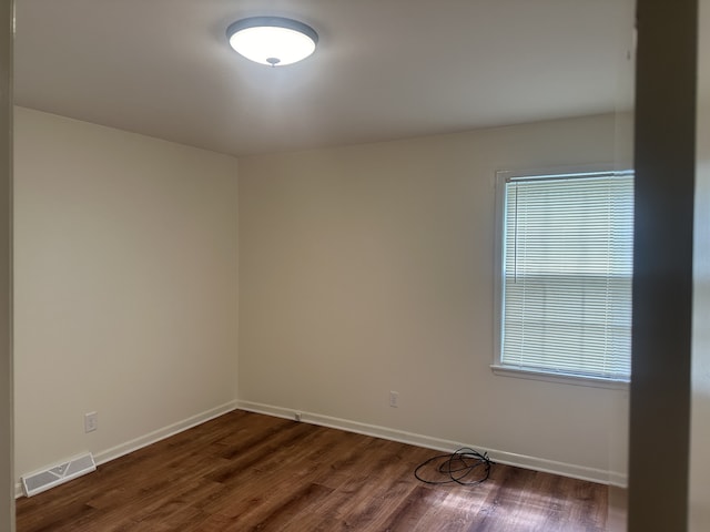 empty room featuring dark hardwood / wood-style floors