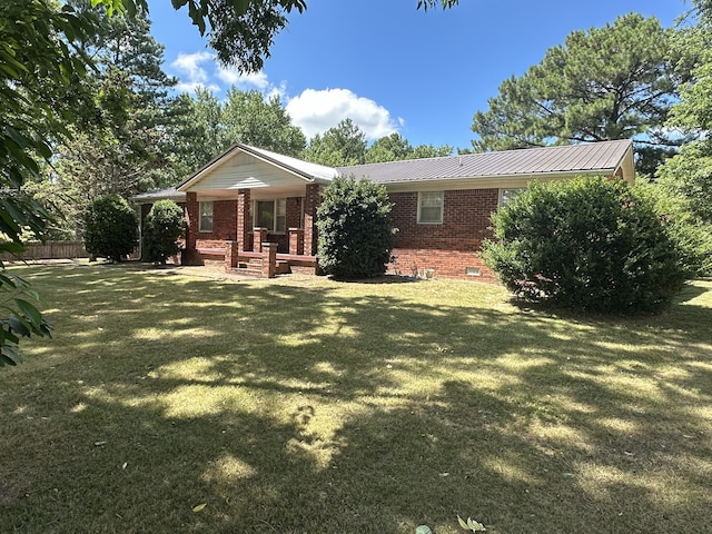 back of property featuring a lawn and a porch