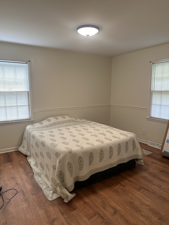 bedroom featuring dark hardwood / wood-style floors