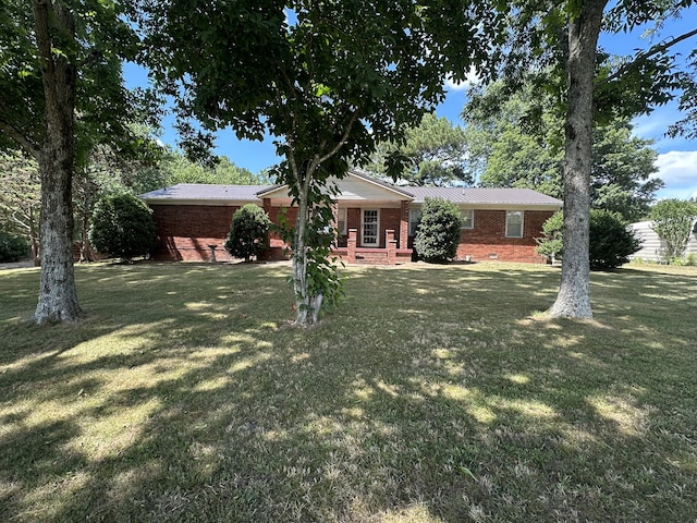 ranch-style house with a front lawn