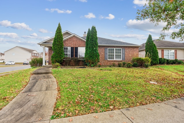 ranch-style house featuring a front lawn