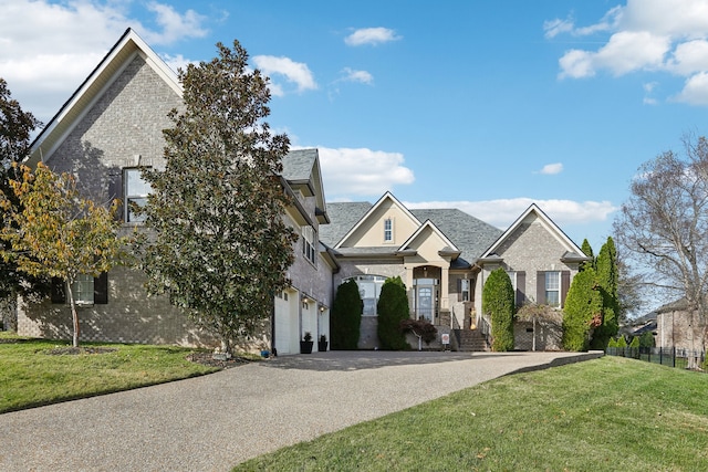 view of front of property featuring a garage and a front lawn