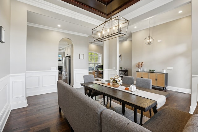 dining room featuring dark hardwood / wood-style floors and ornamental molding