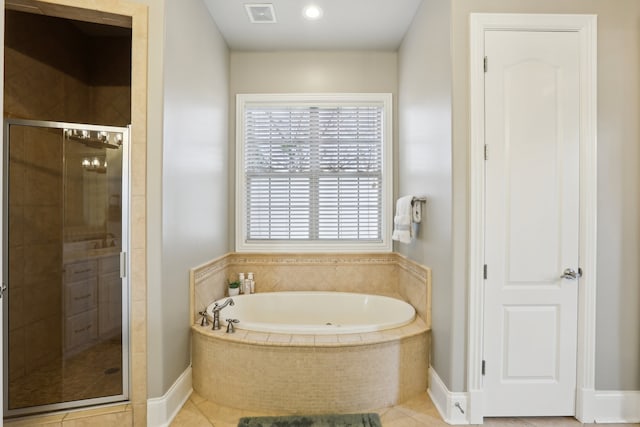 bathroom featuring tile patterned floors and plus walk in shower