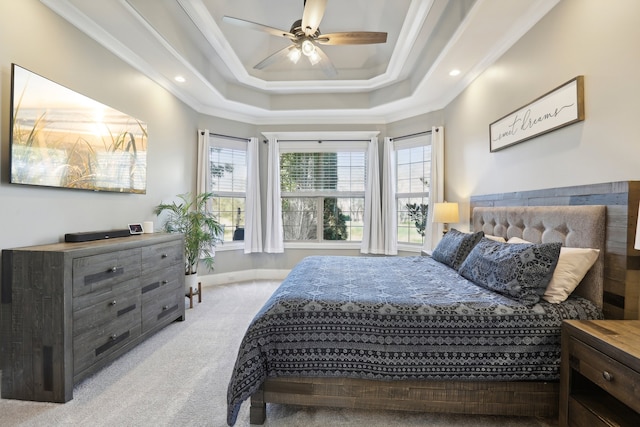 bedroom featuring light colored carpet, multiple windows, and ceiling fan