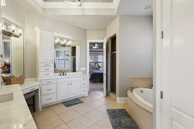 bathroom with vanity, tiled bath, tile patterned floors, and crown molding